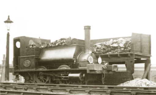 No.227 had a short life; built in 1897 and scrapped in December 1911, it's seen here at one of its regular haunts the Devonshire Street goods depot (later Mile End) sometime after 1903.  The GER utilised an incredibly complex lights and discs system  which at this time ran to 217 codes. 227 displays Ordinary & Special Day Code 41 - white over the coupling hook and green with white rim over the right buffer which signified the loco had worked a train into the Up Reception siding at Devonshire Street.  A note in the Appendix to the Working Timetable notes that the code must only be put on at the last stopping station and not carried beyond the depot. The coaling scene with the high timber coaling stage very much resembles what I have in mind for Angel Lane.